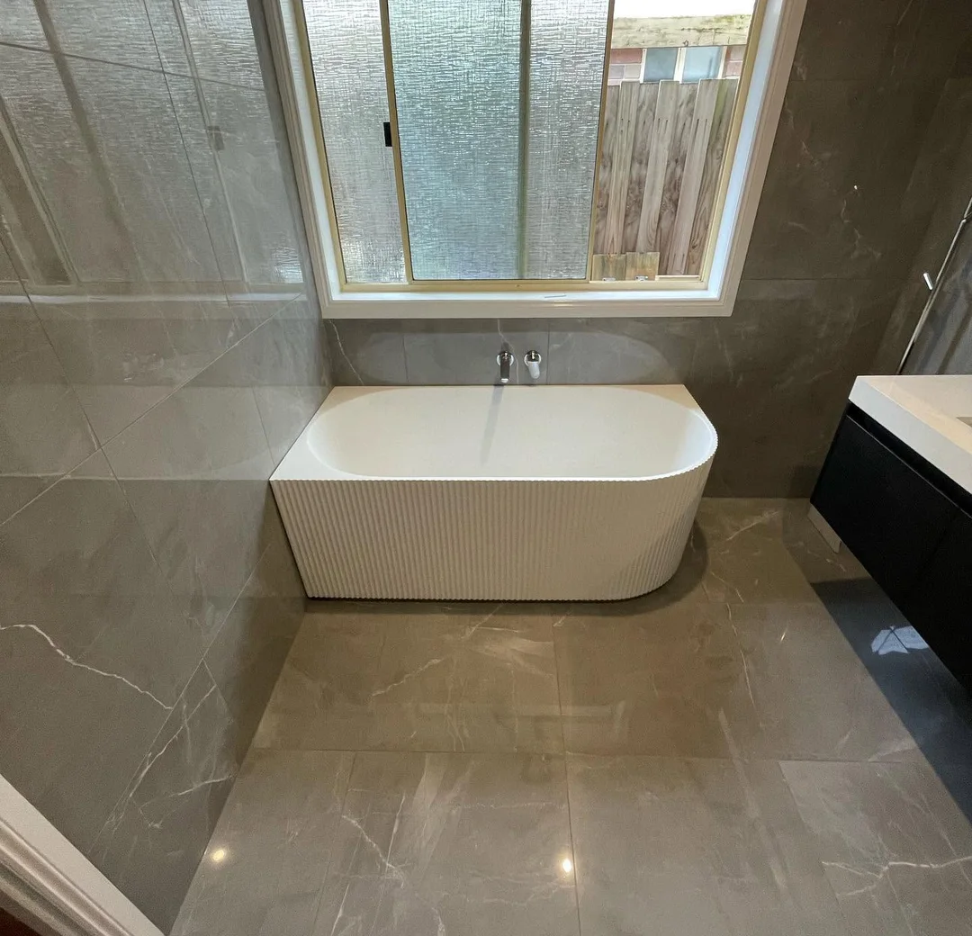 Freestanding bath in a completed bathroom renovation
