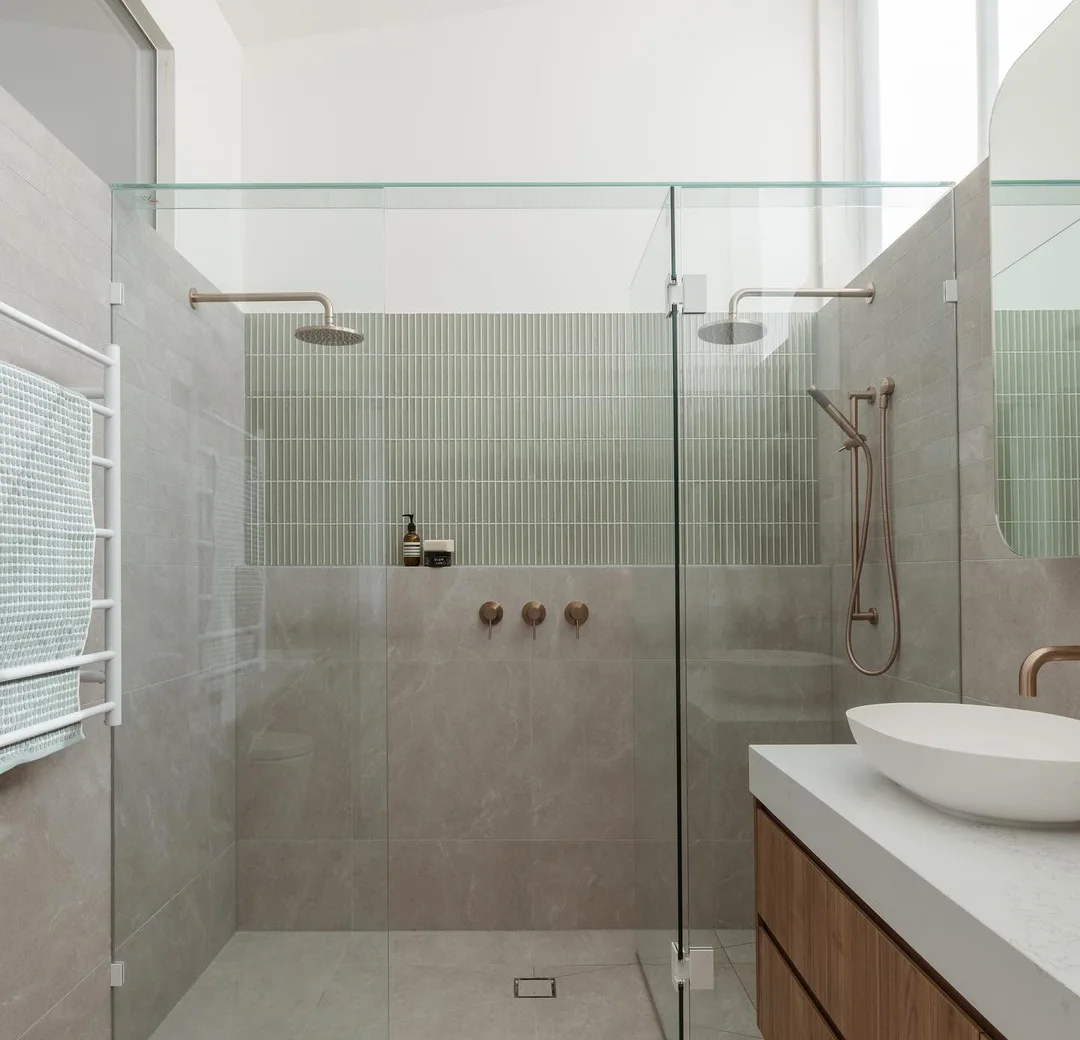 Finished walk-in shower in a completed bathroom renovation