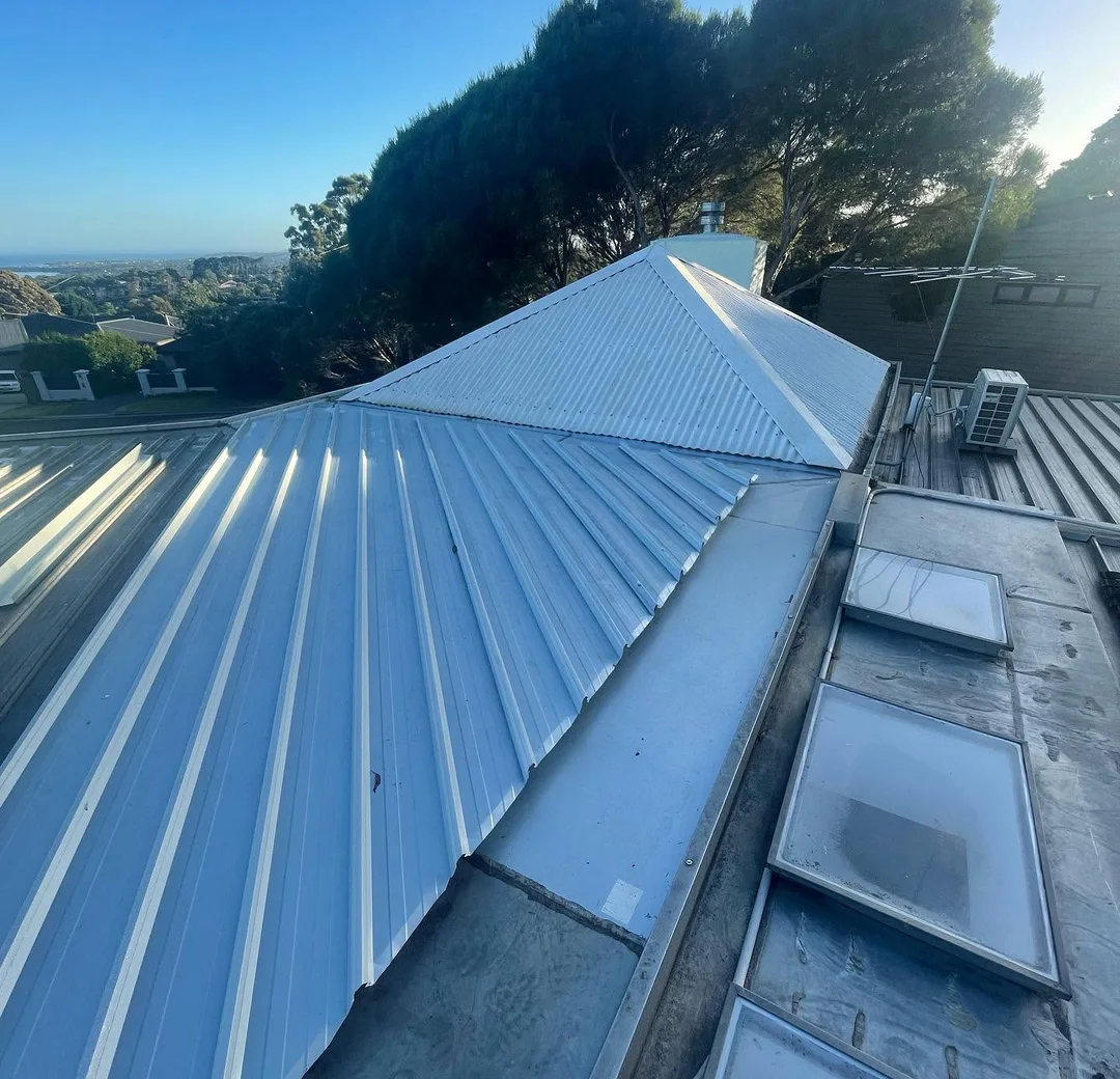 Metal roof ridge and skylights on a recently completed roof