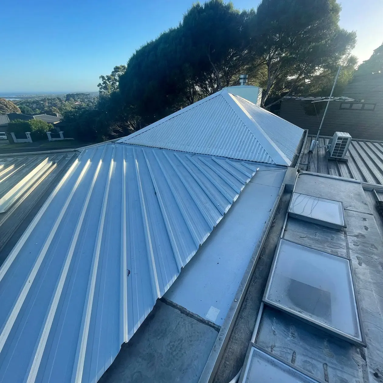 Metal roof ridge and skylights on a recently completed roof